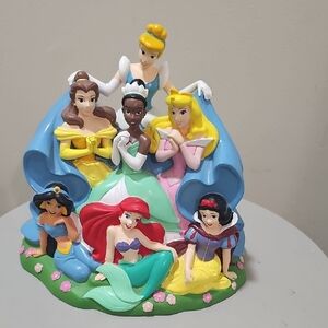 Vintage Disney Piggy Bank 7 Princesses Plastic Coin  Figurine with Floral Base